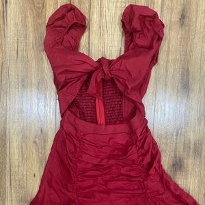 ❌SOLD❌ Red mini dress with front bow and slit.